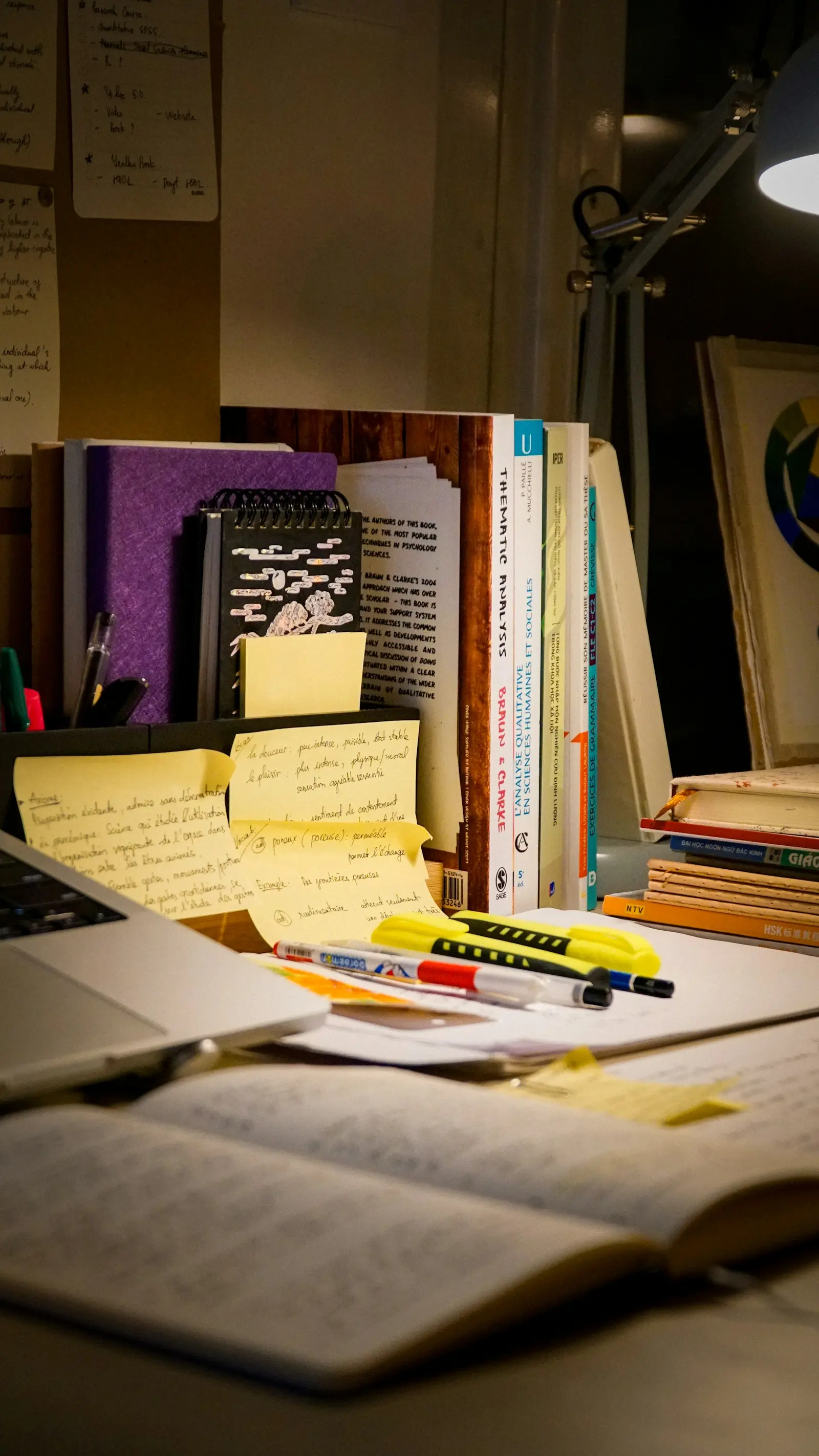 Books, notes and laptop on a study desk